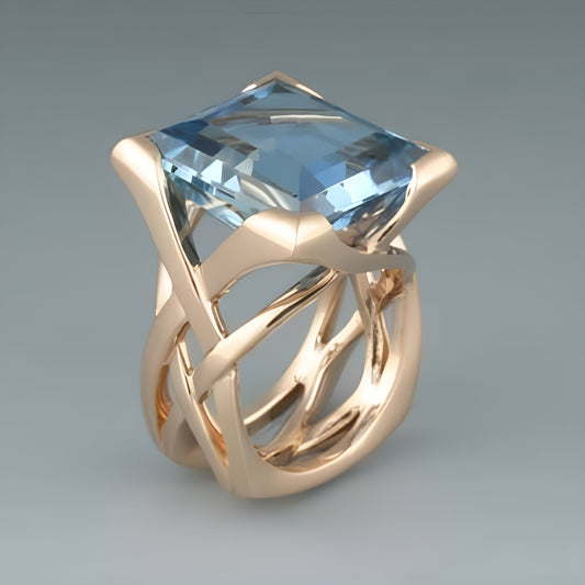 Bague vintage en or rose avec zirconium bleu