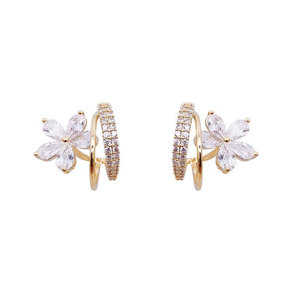 Boucles d'oreilles florales en or avec zirconia étincelant